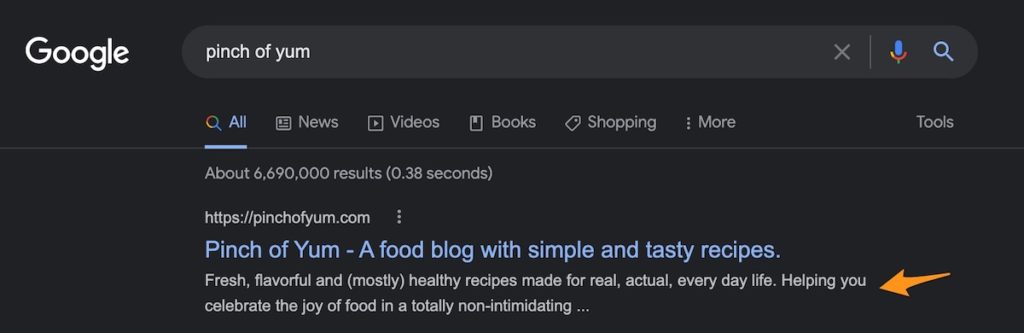 an orange arrow pointing to the meta description in a Google Search result for Pinch of Yum